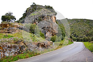 Cliff over a road in Patrimonio, Corsica photo