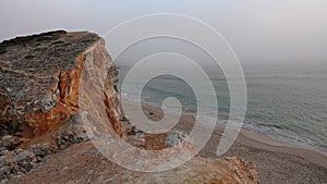 Cliff of Praia do Tonel near Sagres in the Atlantic Ocean in Portugal