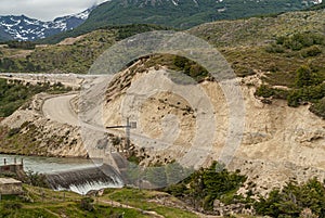 Cliff of quarry with dirtroad and waterfall, Ushuaia, Argentina photo