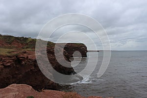 Cliff on the rugged coastline of Prince Edouard Island photo