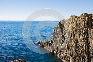 The cliff with the sea in Riomaggiore