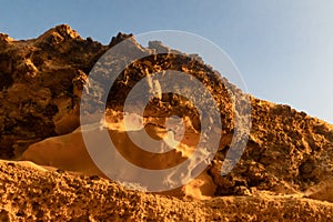 Cliff seen from below with the beautiful light of the sunset