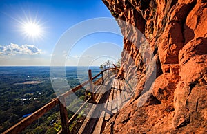 Cliff side wooden bridge at Wat Phu tok, Bueng Kan, Thailand photo