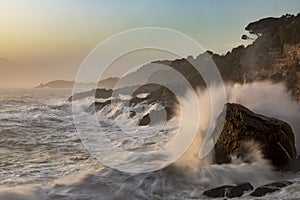 Cliff with stormy waves in Tellaro