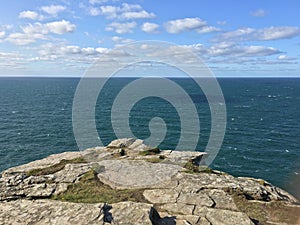 Cliff at Tintagel castle in Cornwall, England with the Atlantic Ocean coastline., UK, England