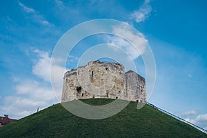 Clifford`s Tower, the 13th-century castle keep, built on a grass mound, formerly used as a prison and royal mint photo