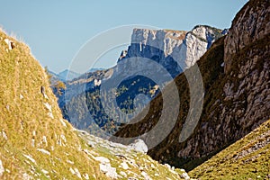 Cliffs above the Sealpsee from pass above the Berggasthaus Mesmer, Alpstein - Apenzell, Switzerland photo