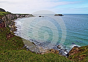 Cliffs along Irish Coast next to tiny Carrick-a-rede island