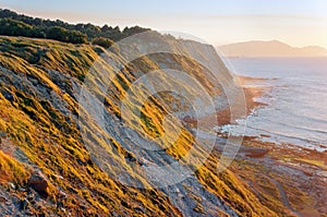 Cliffs of Azkorri beach at sunset