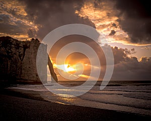 Cliffs on the beach of Etretat, France, at sunset