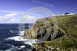 Cliffs and breaking waves at Lands End in Cornwall