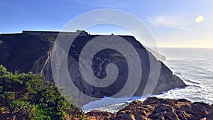 Cliffs at Cape Espichel on coast of Atlantic Ocean. The location is famous for sanctuary complex