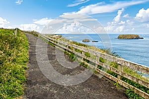 Cliffs of Carrick-a-rede rope bridge in Ballintoy, Co. Antrim. Landscape of Northern Ireland.