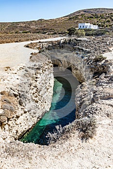 Cliffs, cave and house in Papafragas beach