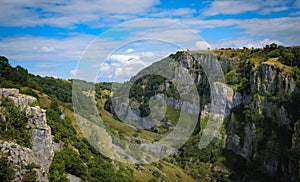 Cliffs of Cheddar Gorge from high viewpoint. High limestone cliffs in canyon in Mendip Hills in Somerset, England