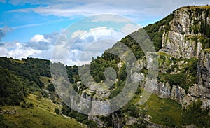 Cliffs of Cheddar Gorge from high viewpoint. High limestone cliffs in canyon in Mendip Hills in Somerset, England