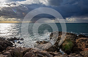 Cliffs of a coast at the baltic sea - heavy clouds over the ocean