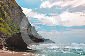 The cliffs and coastline of Seruni Beach, Yogyakarta, Indonesia