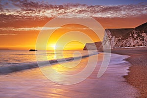 Cliffs at Durdle Door beach in Southern England at sunset