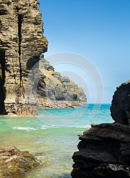 Cliffs jutting into the ocean from Bossiney Haven cove, Cornwall