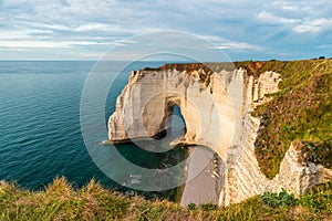 Cliffs and la Manneporte natural arch of Etretat, Normandy, France. French sea coast in Normandie with famous rock