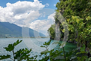 Cliffs of Lake Idro behind bushes