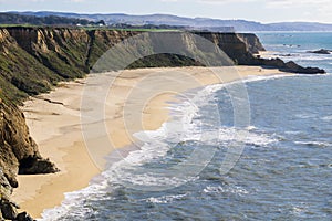 Cliffs and large half moon shaped beach, Pacific Ocean Coast, Half Moon Bay, California