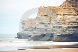 cliffs with layers of sedimentary rock by the sea