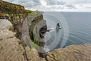 Cliffs of Moher and the Branaunmore sea stack seen from a plateau