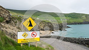 Cliffs of Moher with danger sign and road