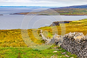 Cliffs of Moher with Doolin village and farm fields in background