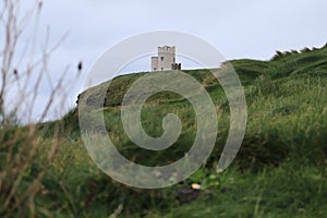 Cliffs of Moher - evening view - landscape with tower - Northern Ireland - Irish travel - popular tourist attraction