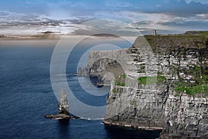 Cliffs of Moher in sunny and cloudy day, seashore of West Ireland, Wild Atlantic Road