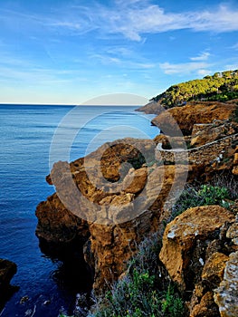 Cliffs near Cala Marquesa Aigua Xelida in Tamariu, Spain photo