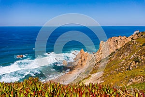 Cliffs and rocks on the Atlantic ocean coast - Praia da Ursa beach