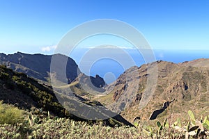 Cliffs and rocks panorama with Atlantic Ocean and La Gomera in the background on Canary Island Tenerife, Spain