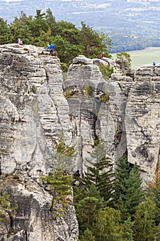 Cliffs, rocky towers with mountain climbers.