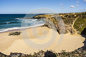 Cliffs and sand on Cerca Nova Beach, Alentejo, Portugal