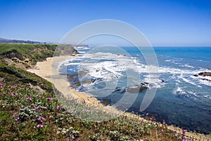 Cliffs and sandy beach on the Pacific Ocean coastline