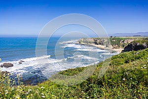 Cliffs and sandy beach on the Pacific Ocean coastline