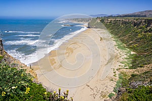 Cliffs and sandy beach on the Pacific Ocean coastline