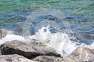 cliffs on the seashore and waves splashing on the rocks.