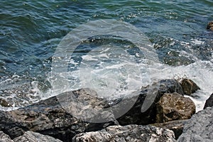 cliffs on the seashore and waves splashing on the rocks.