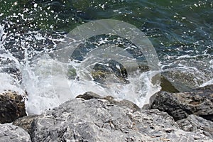 cliffs on the seashore and waves splashing on the rocks.