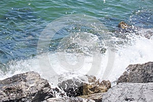 cliffs on the seashore and waves splashing on the rocks.