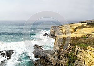 Cliffs on Vicentine Coast near Zambujeira do Mar beach and  Alentejo Natural Park in Portugal photo