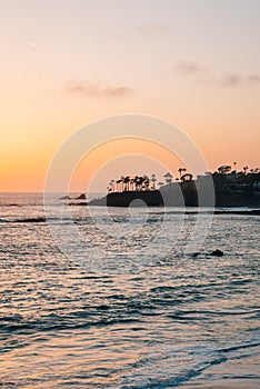 Cliffs and waves in the Pacific Ocean at sunset, in Laguna Beach, Orange County, California