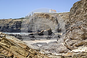 Cliffy beach in Zambujeira Do Mar, Vincentina Coast Natural Park, Alentejo, Portugal photo