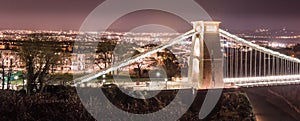 Clifton Suspension Bridge with Bristol cityscape by night