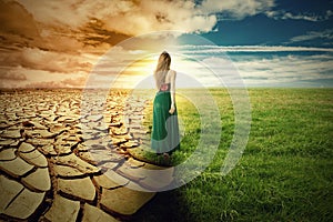 A Climate Change Concept Image. Landscape green grass and drought land photo